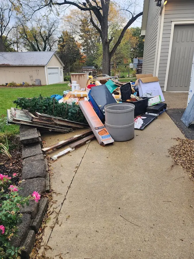 Dumpster being loaded with debris for Commercial Dumpster Rental in Hanover